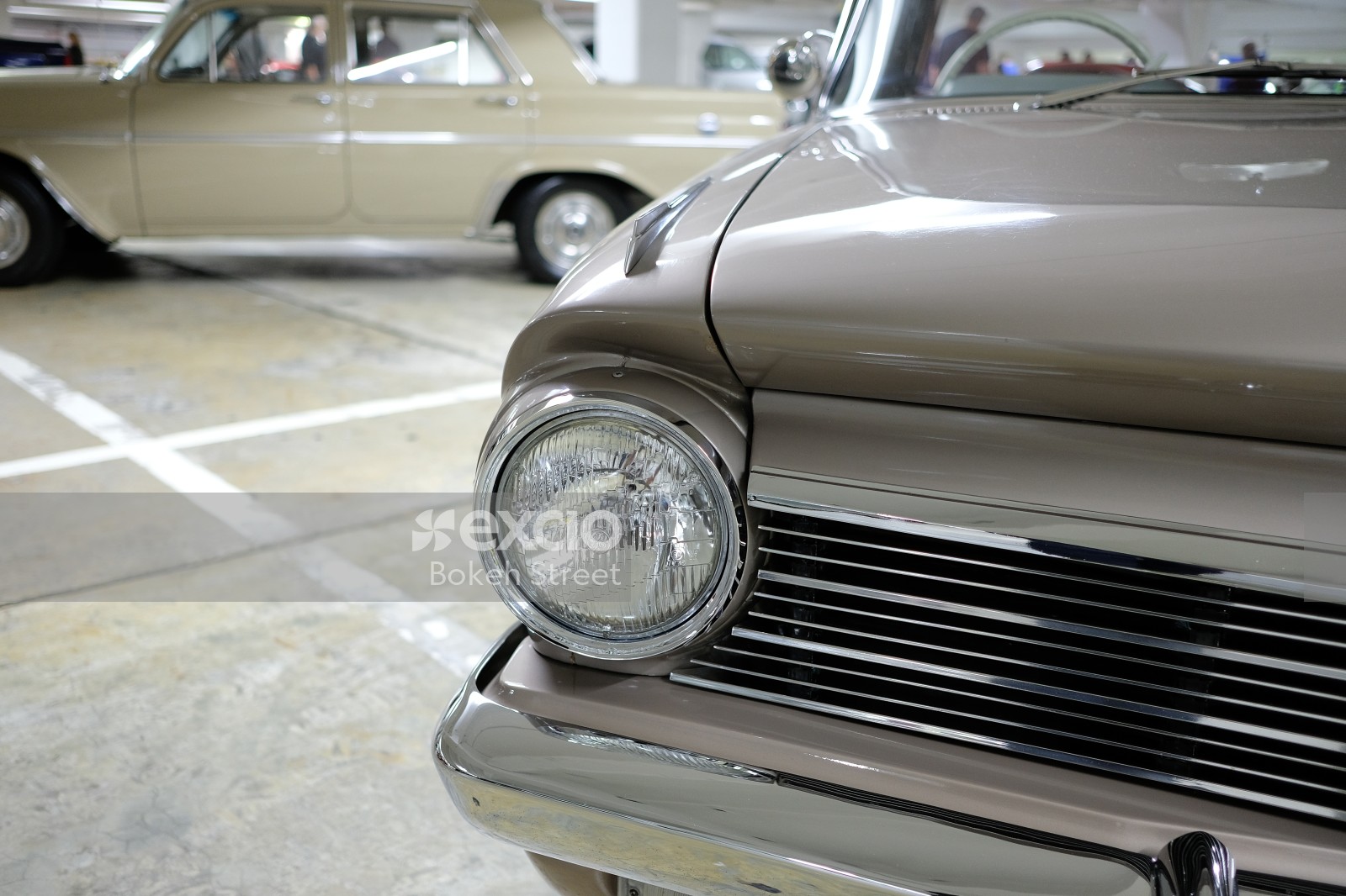 Classic silver Holden EH Premier headlight and grille bokeh