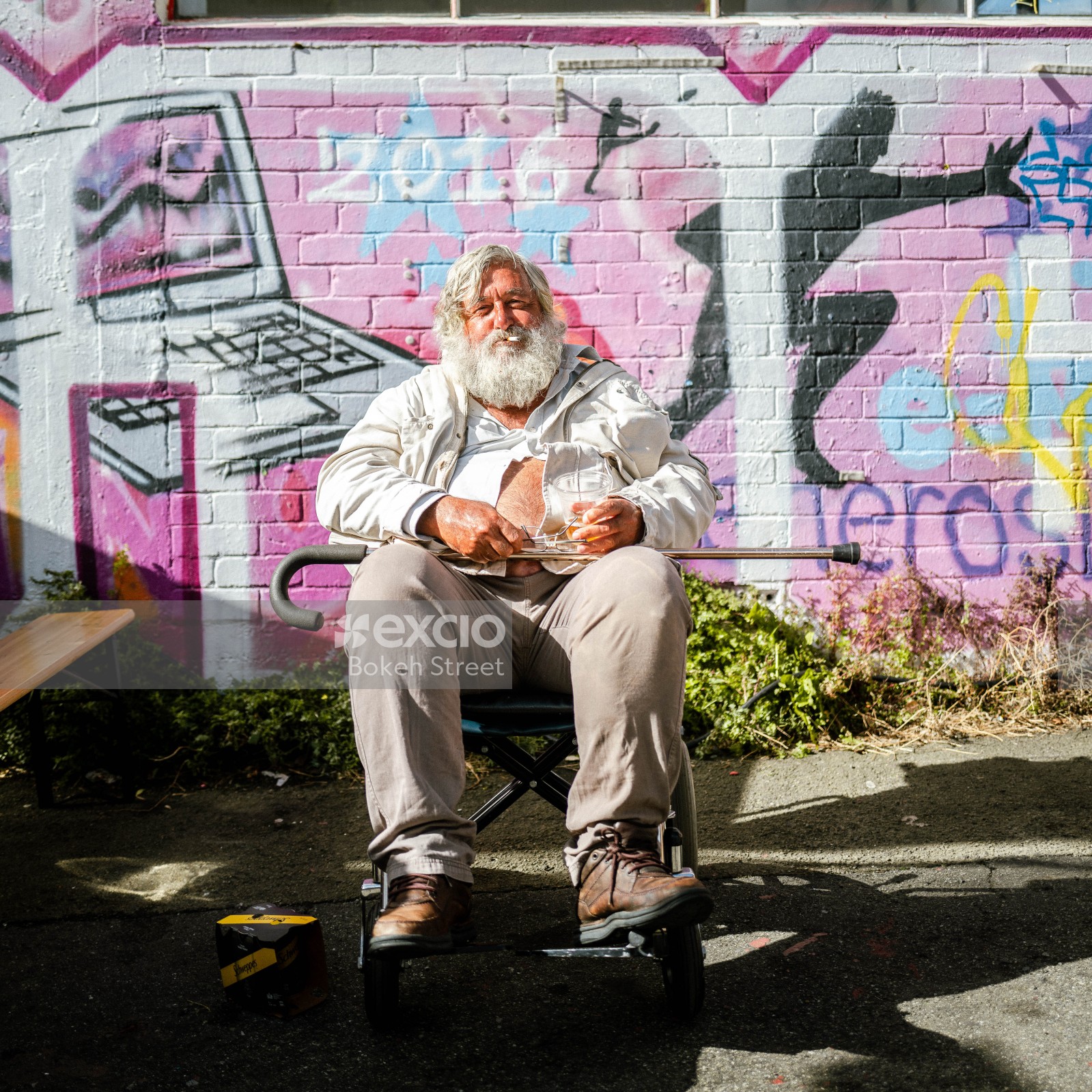 Old bearded guy in a wheel chair at Newtown festival 2021
