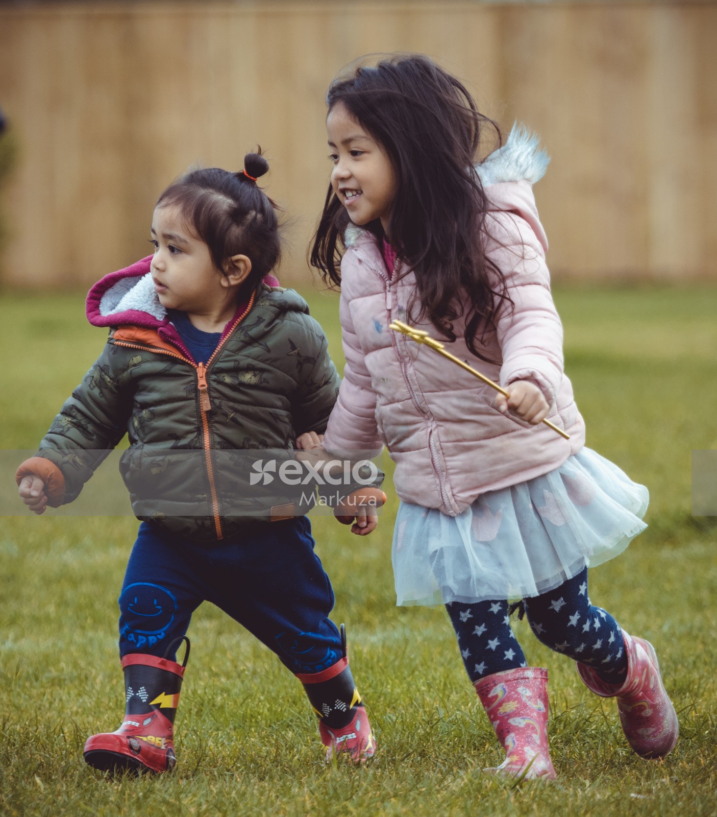 Two girls running with a star wand - Little Dribblers
