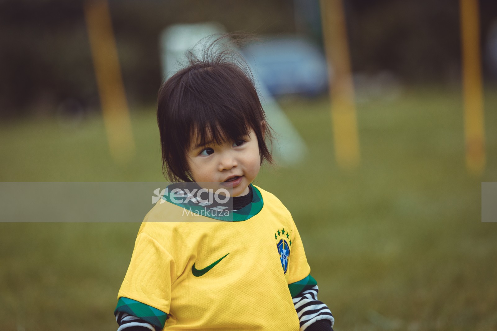 Little Asian kid in Brasil jersey bokeh - Little Dribblers