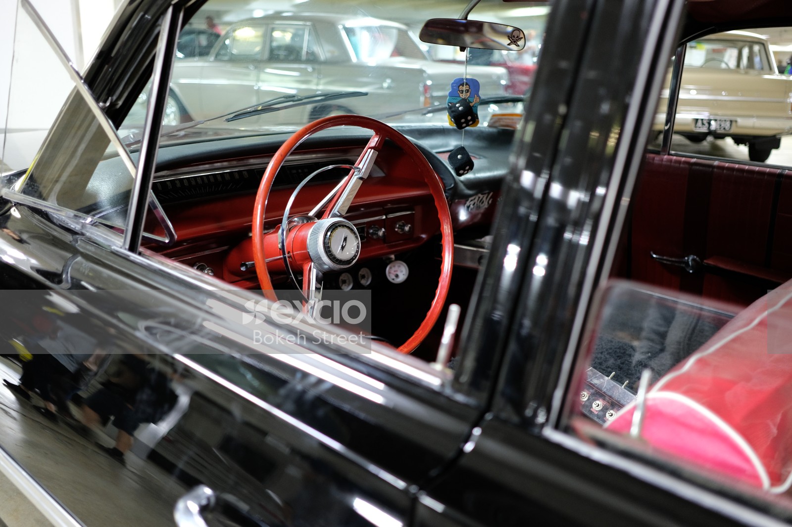 Classic black Chevrolet with red interior