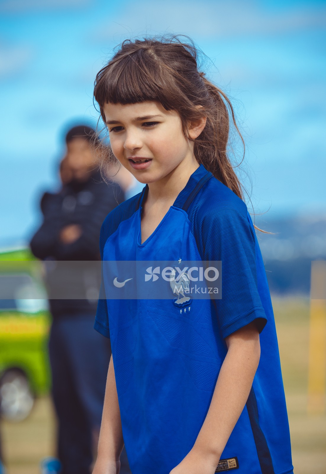Young girl in French kit bokeh portrait at Little Dribblers soccer bout