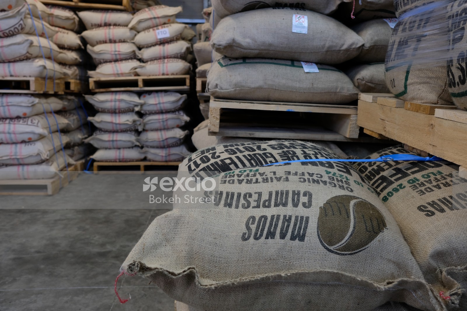 Coffee bean sacks stacked on top of each other at the coffee warehouse