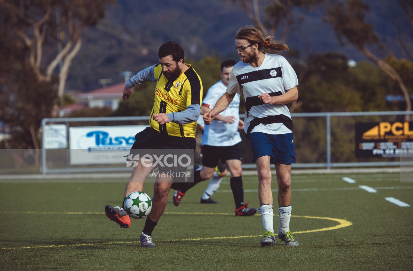 Chubby and long haired player with ponytail - Sports Zone sunday league
