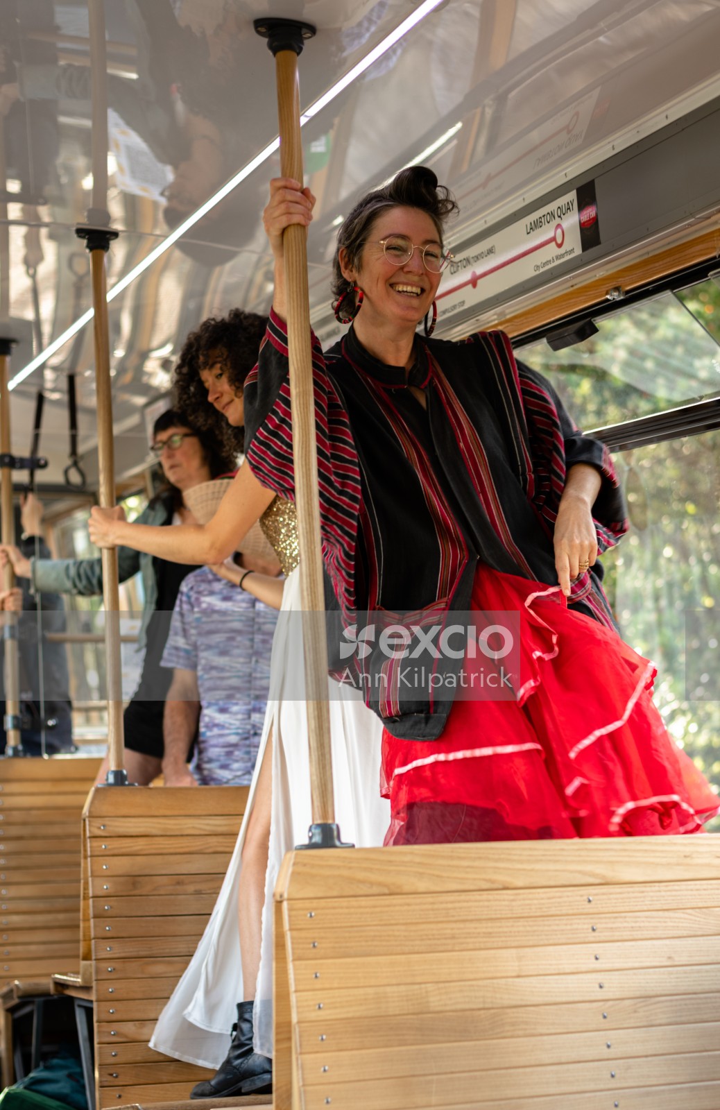 Lady in red dancing on cable car