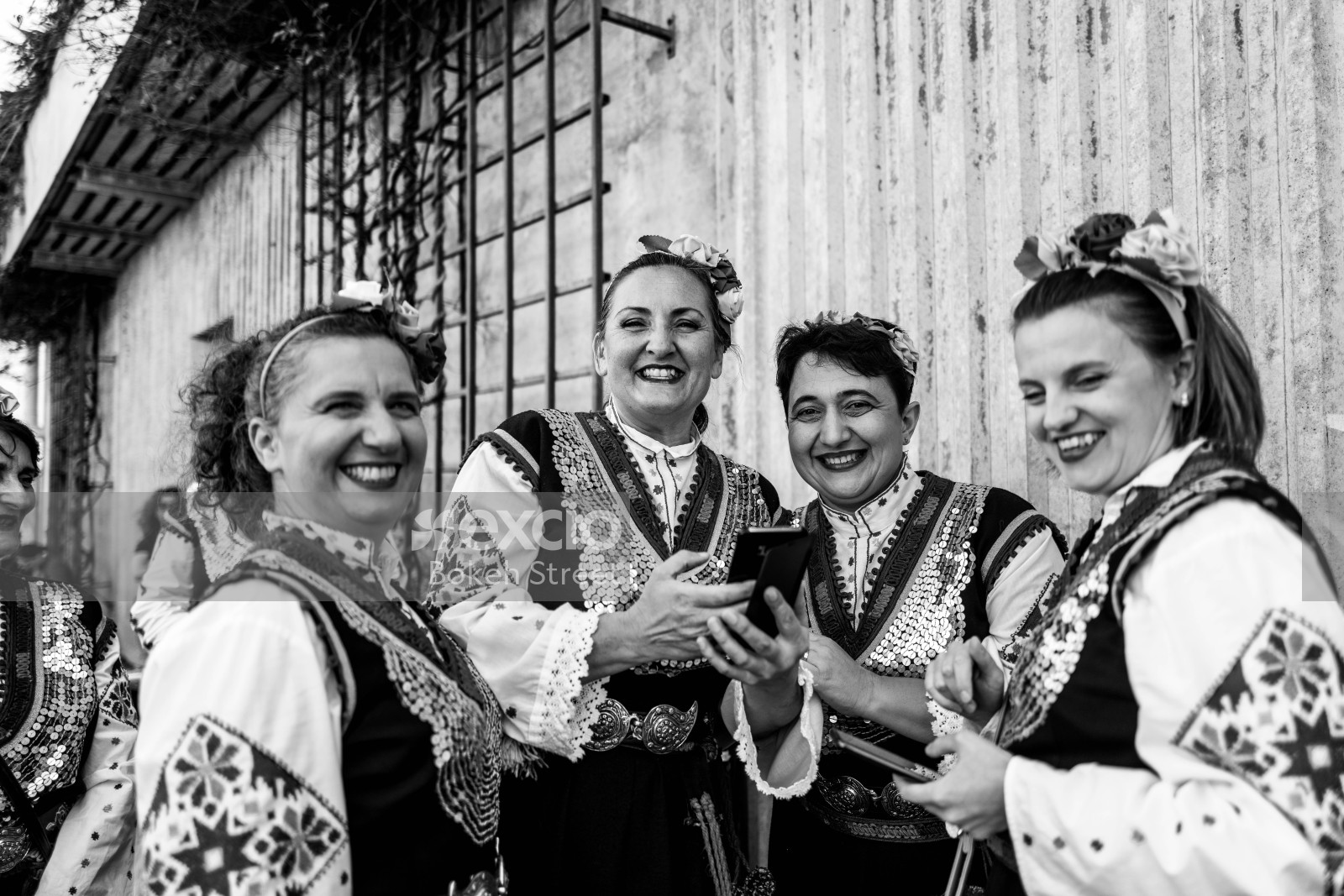 Ladies elegantly dressed in similar outfits posing at Newtown festival 2021 monochrome