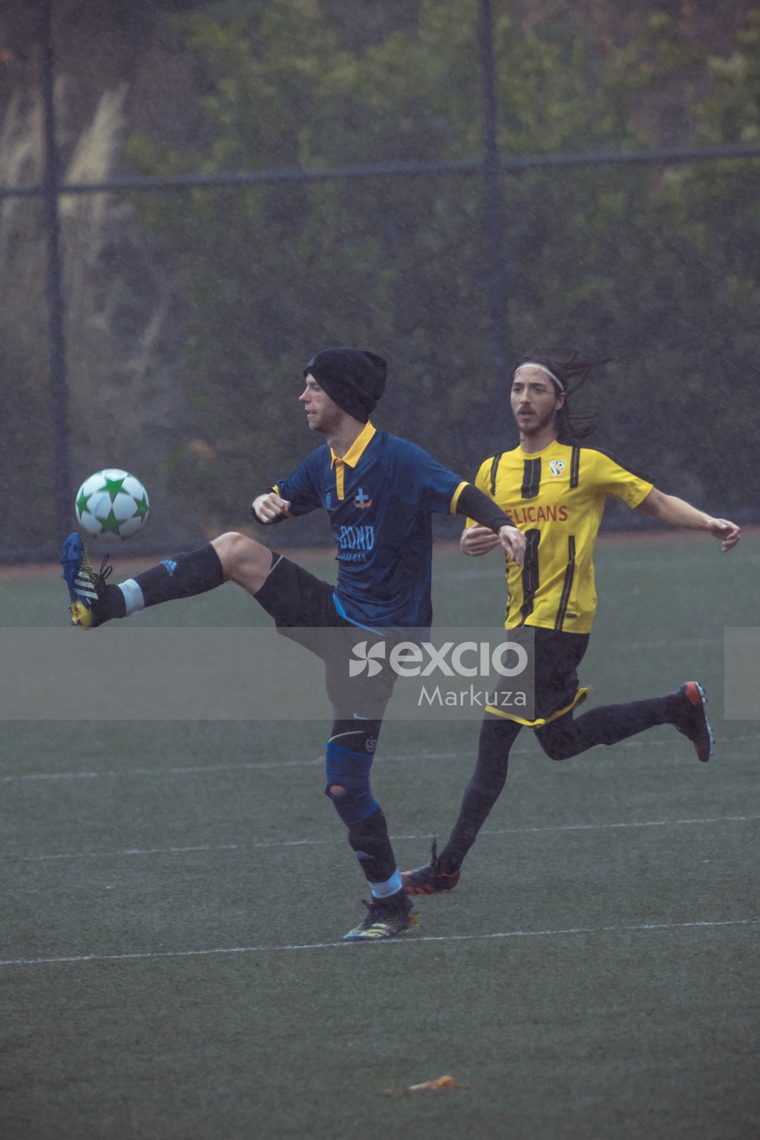 Player in beanie cap lifting ball with his foot - Sports Zone sunday league