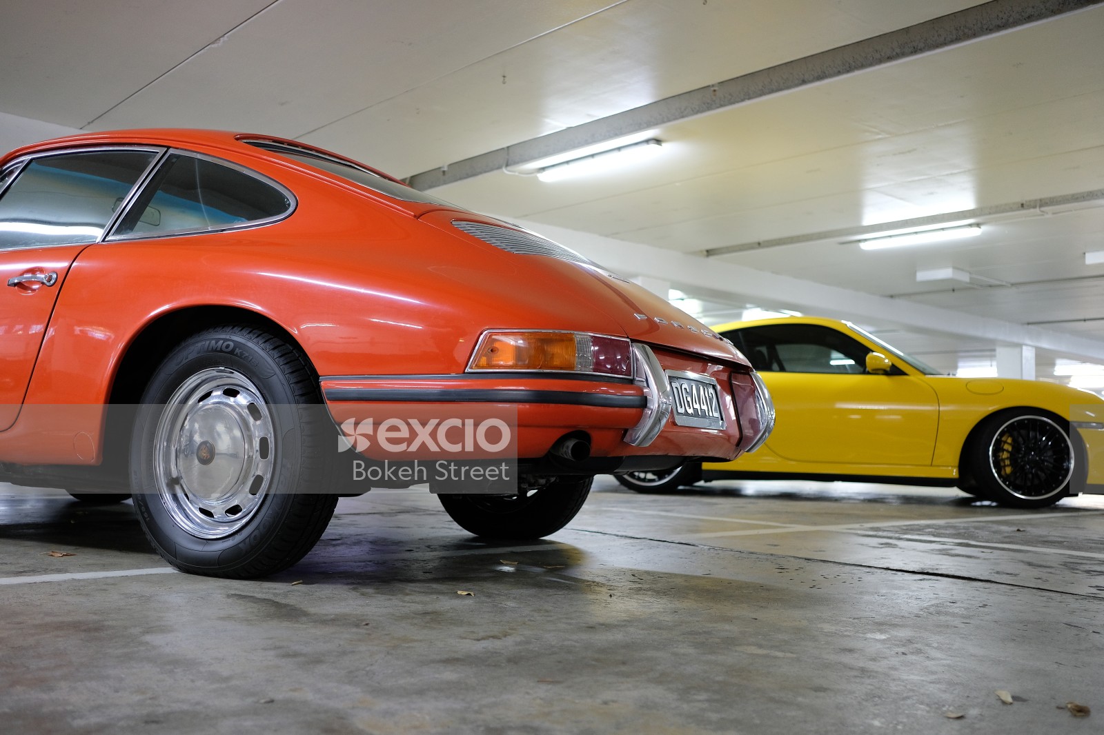 Classic orange and modern yellow Porsche