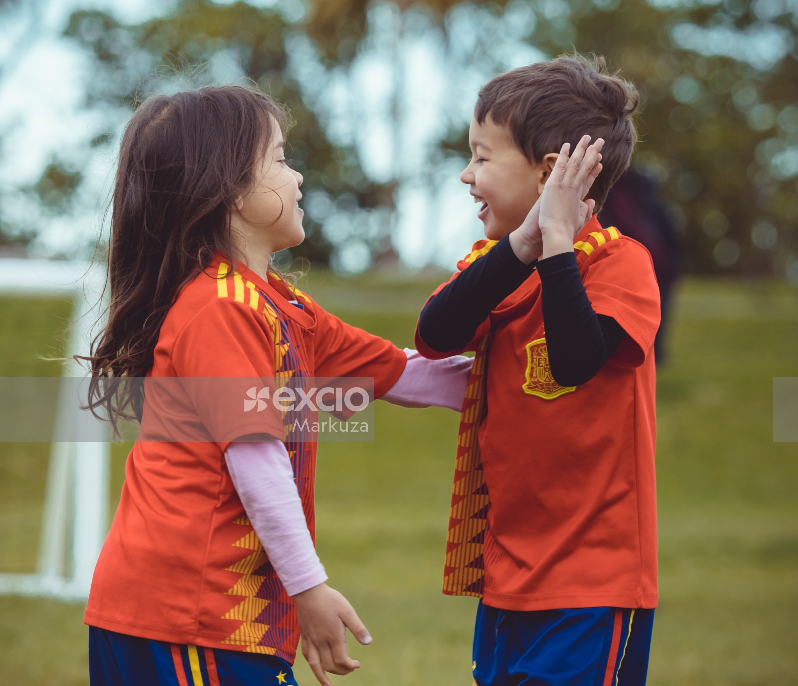 Boy and girl in Manchester United kit playing together -  Little Dribblers